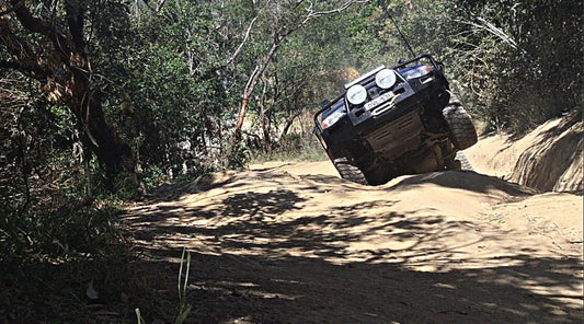 A four wheel drive with some wheel lift on the track down to McBrides Beach. 