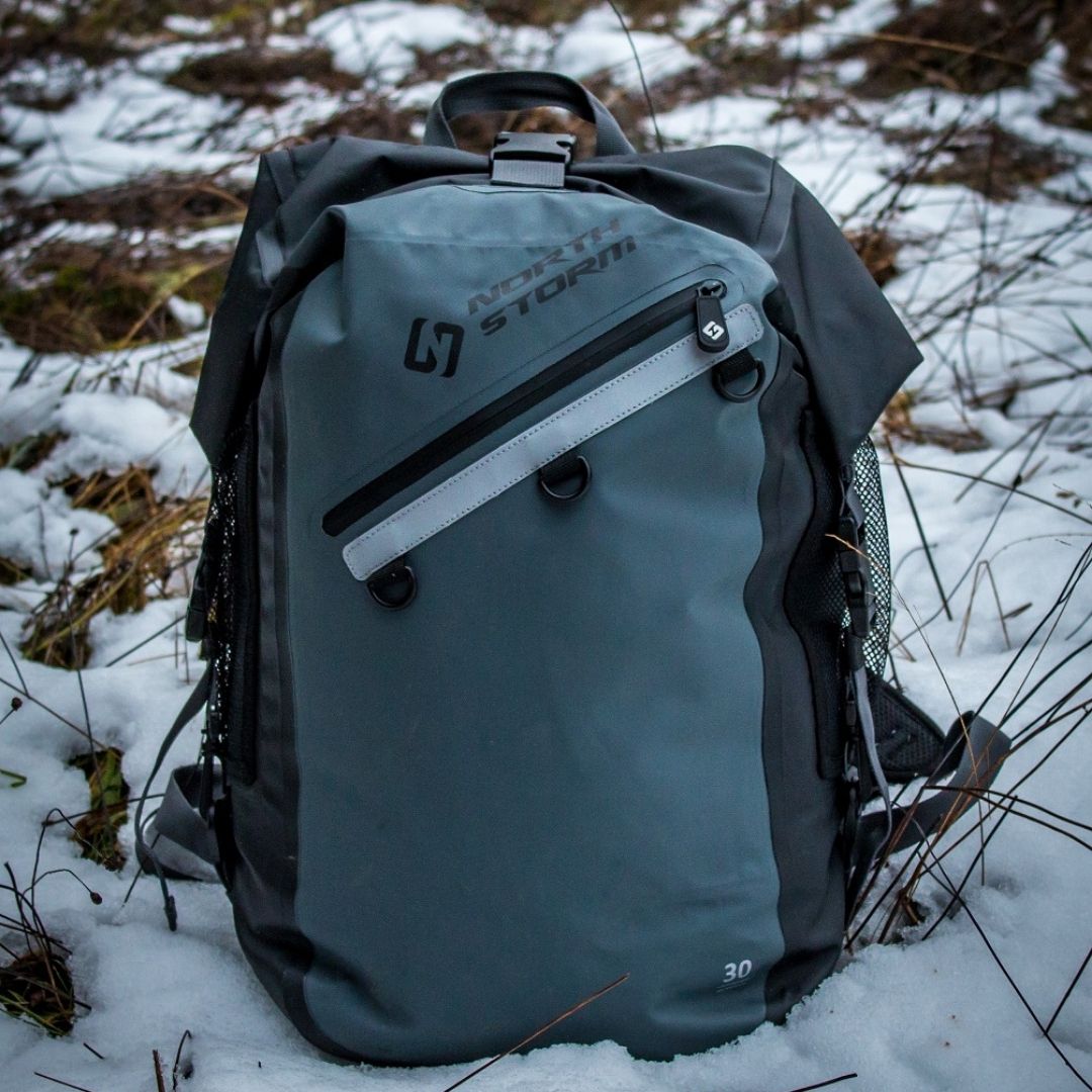 NORTH STORM WATERPROOF BACKPACK SITTING IN THE SNOW AT THE SNOW FIELDS IN AUSTRALIA.