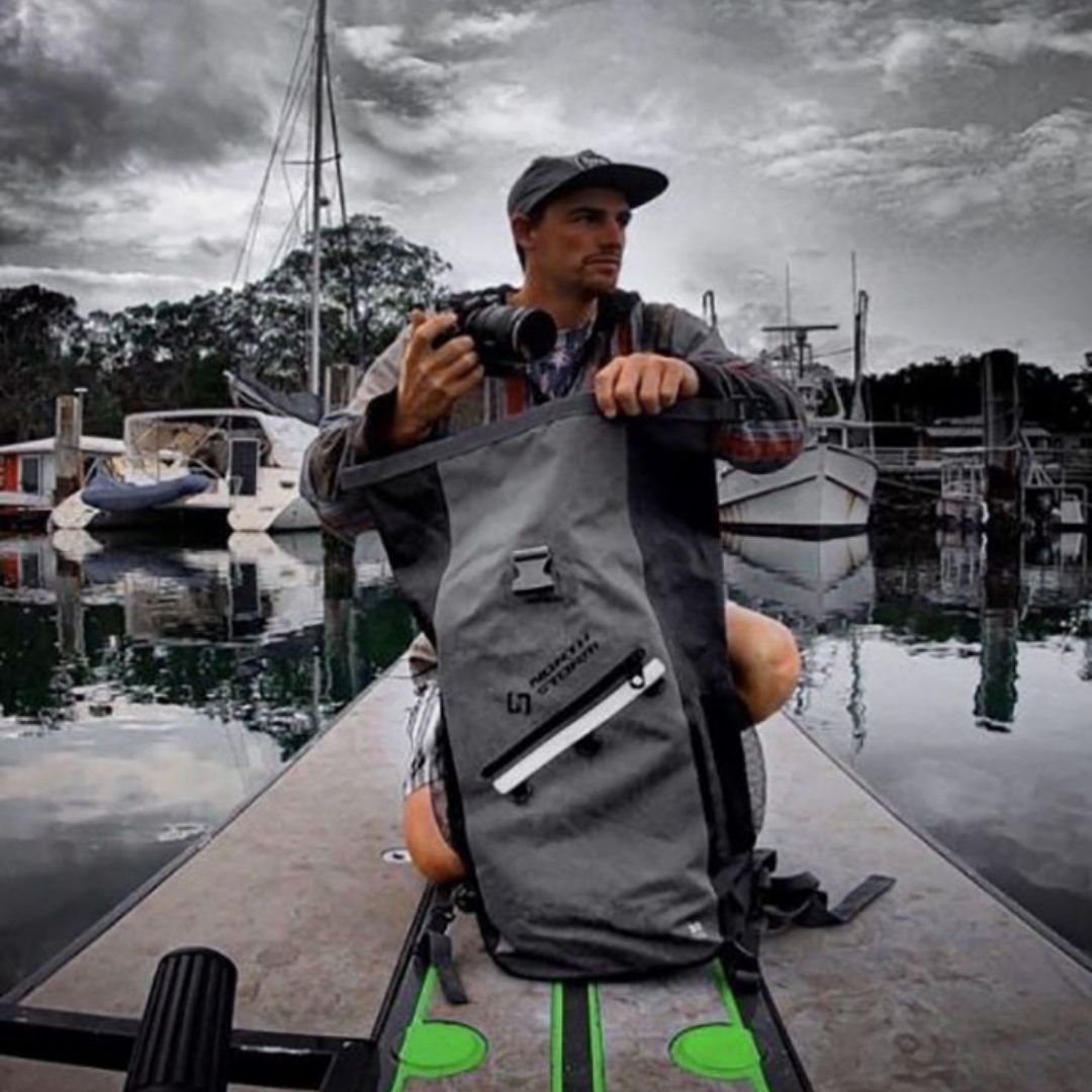 TIMMY TURTLE ON HIS SKIFF WITH A NORTH STORM WATERPROOF BACKPACK.